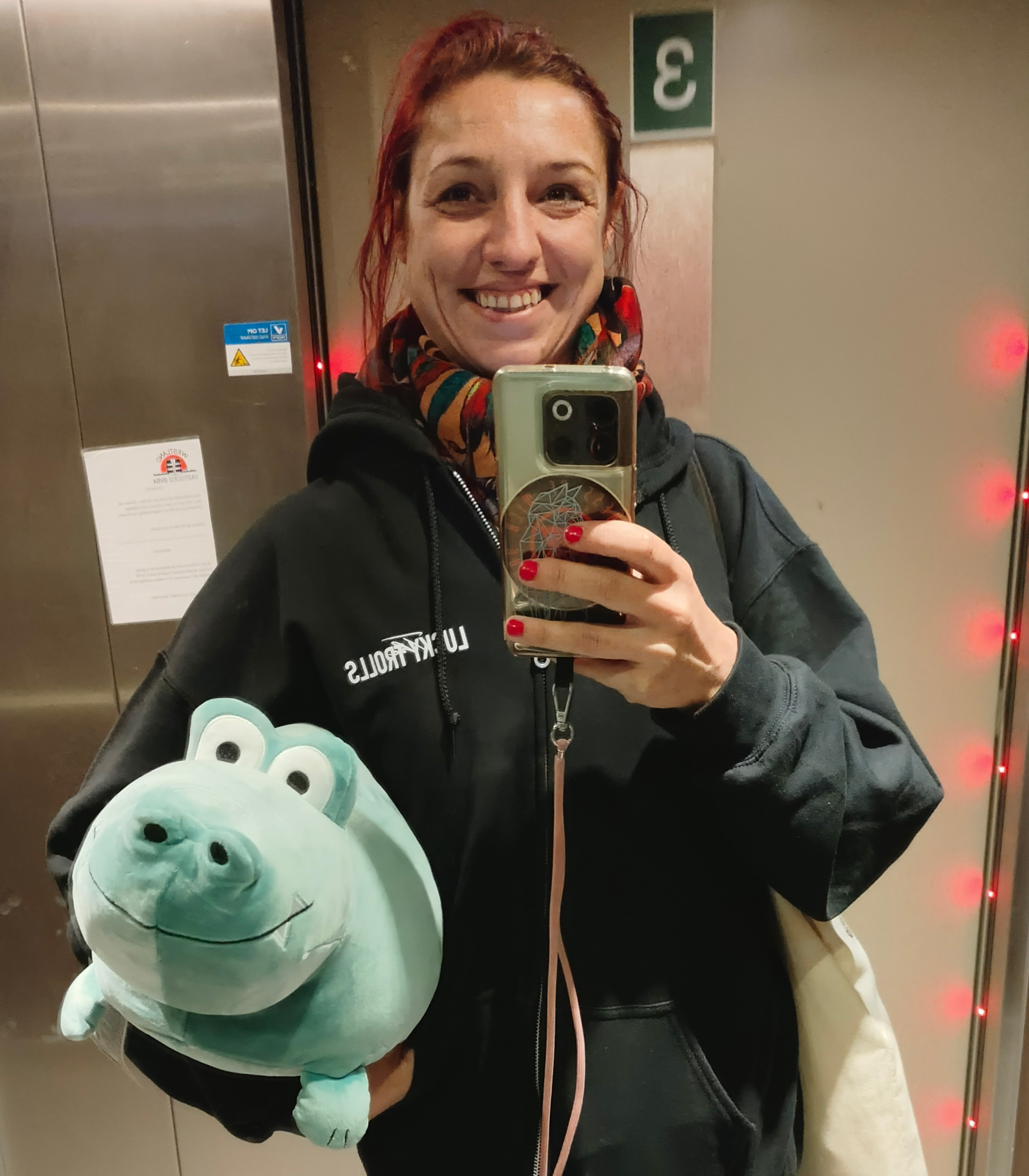 Julie happily smiling while holding her new friend